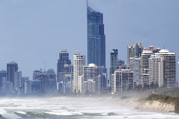 Rough waves at a Gold Coast beach with highrise buildings in the background