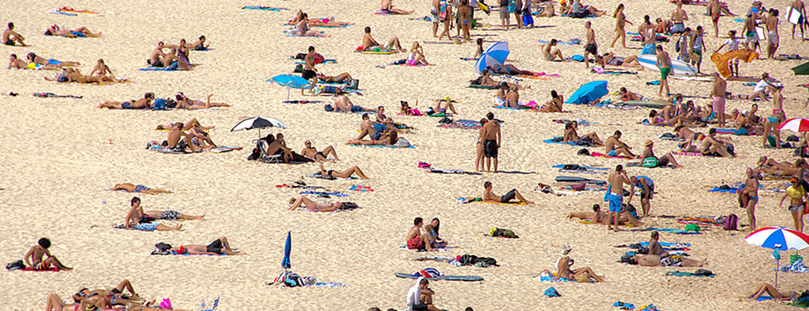 Many people on the sand at Bondi Beach