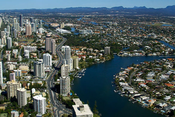 Aerial view of Gold Coast showing beach, highrise buildings, canals and homes