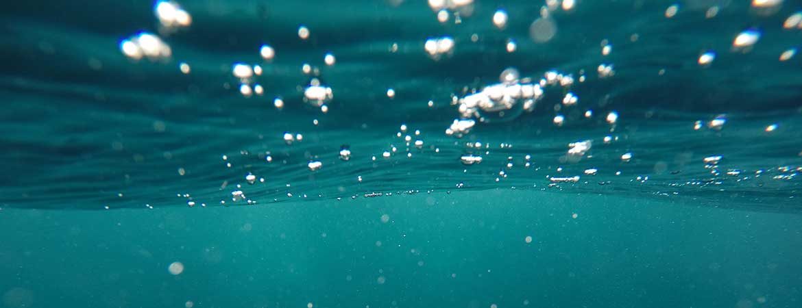 Bubbles in green-blue water